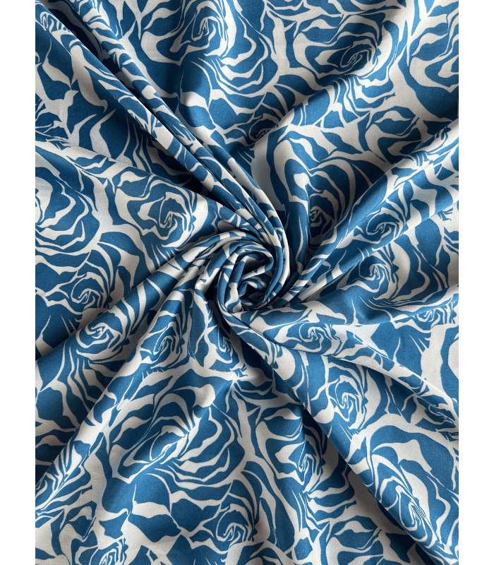 Close-up of Mazza Fabric, silky soft and smooth to the touch, perfect for women’s dresses and tops.