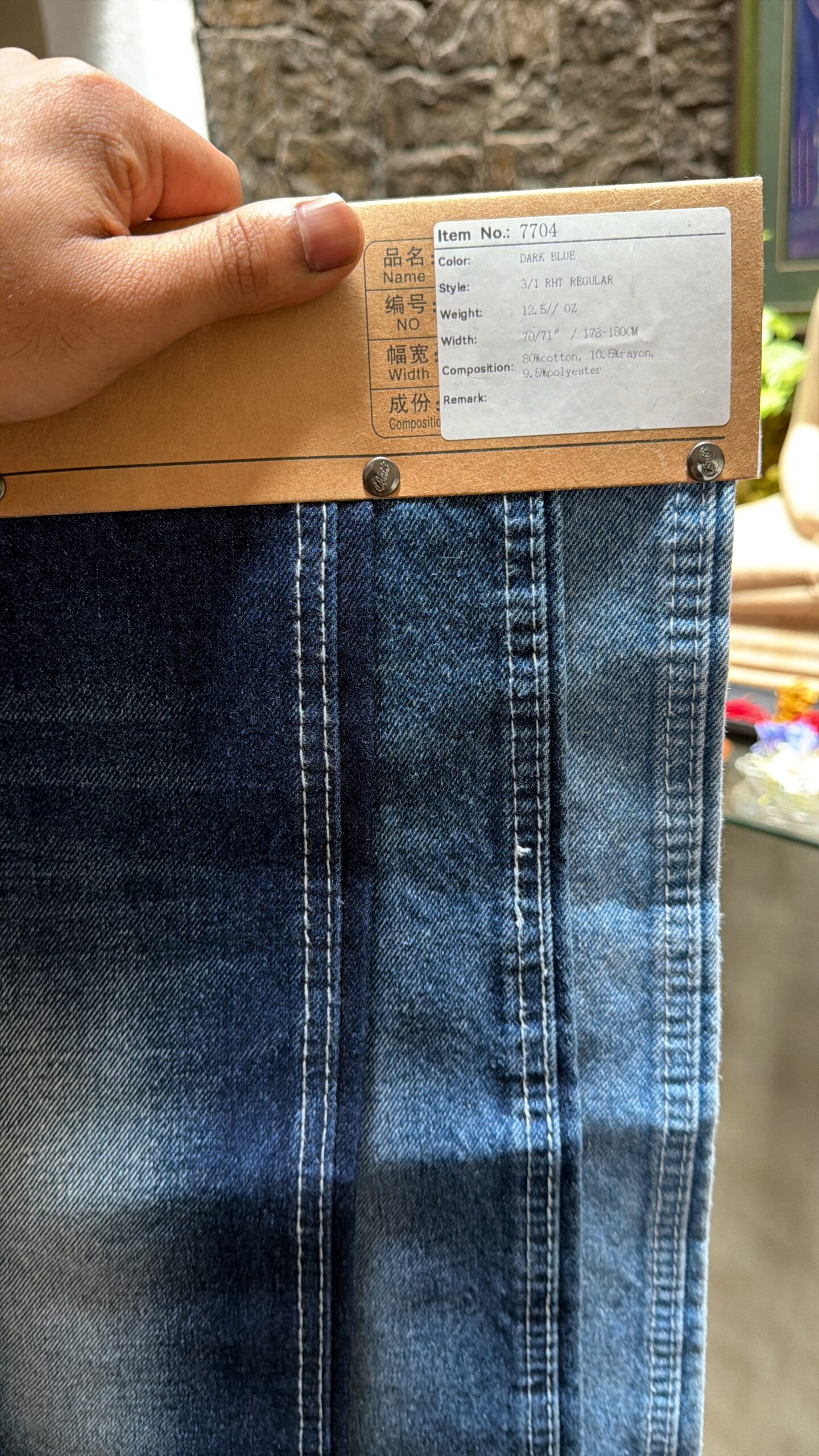 12.5 Oz Dark Blue Denim Fabric – Non-Stretch – PRD-1 Dark blue 12.5 Oz denim fabric sample showing faded wash effects and stitching details, SKU PRD-1.